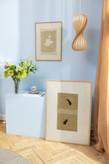 Beige art posters in bluish surroundings