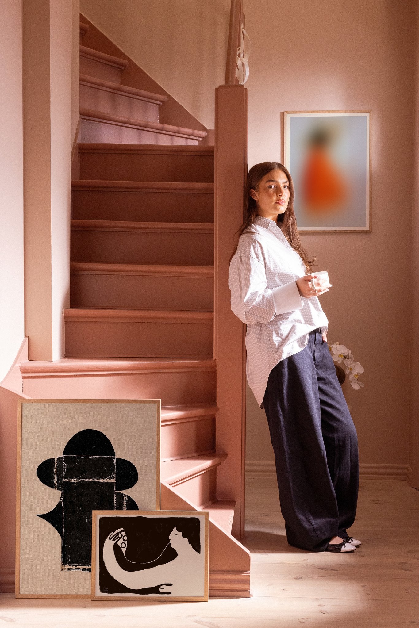 Poster composition in pink hallway
