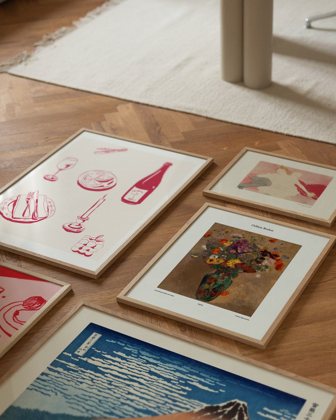 Composition of art prints on the floor